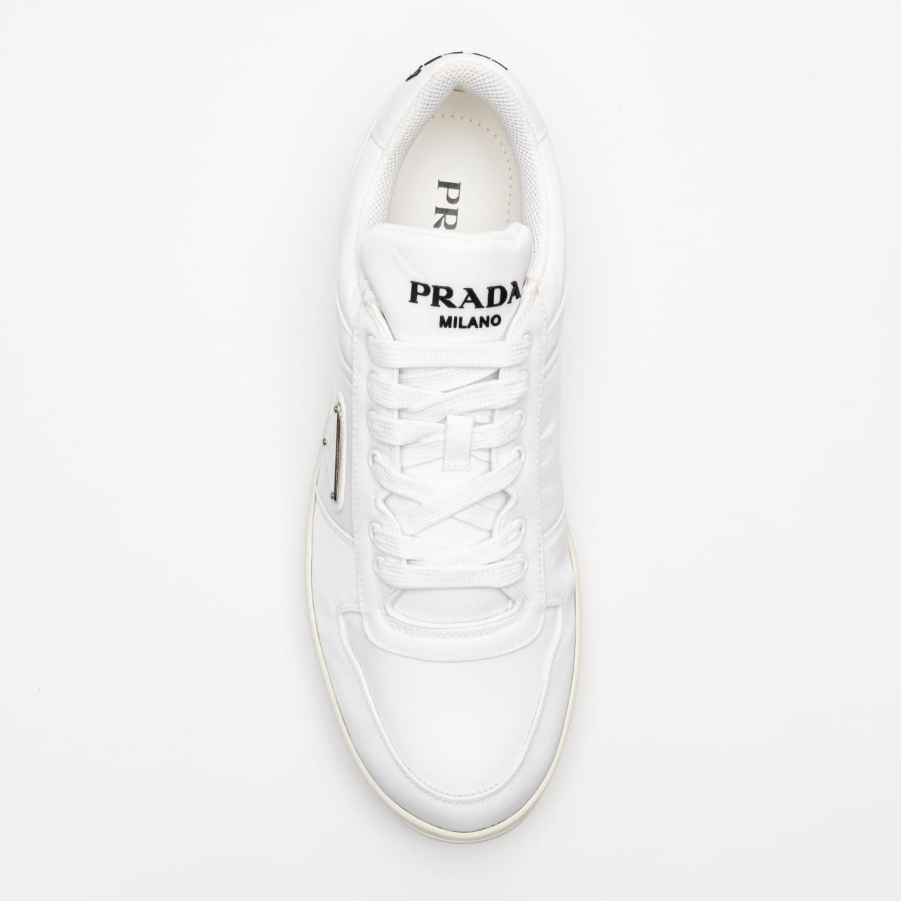 Prada Re-Nylon Sneakers Enameled Metal Triangle Logo White – voilà.id