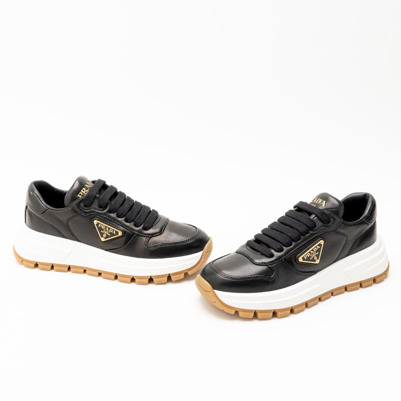 Prada Triangle Gold Metal Logo Sneakers Black – voilà.id