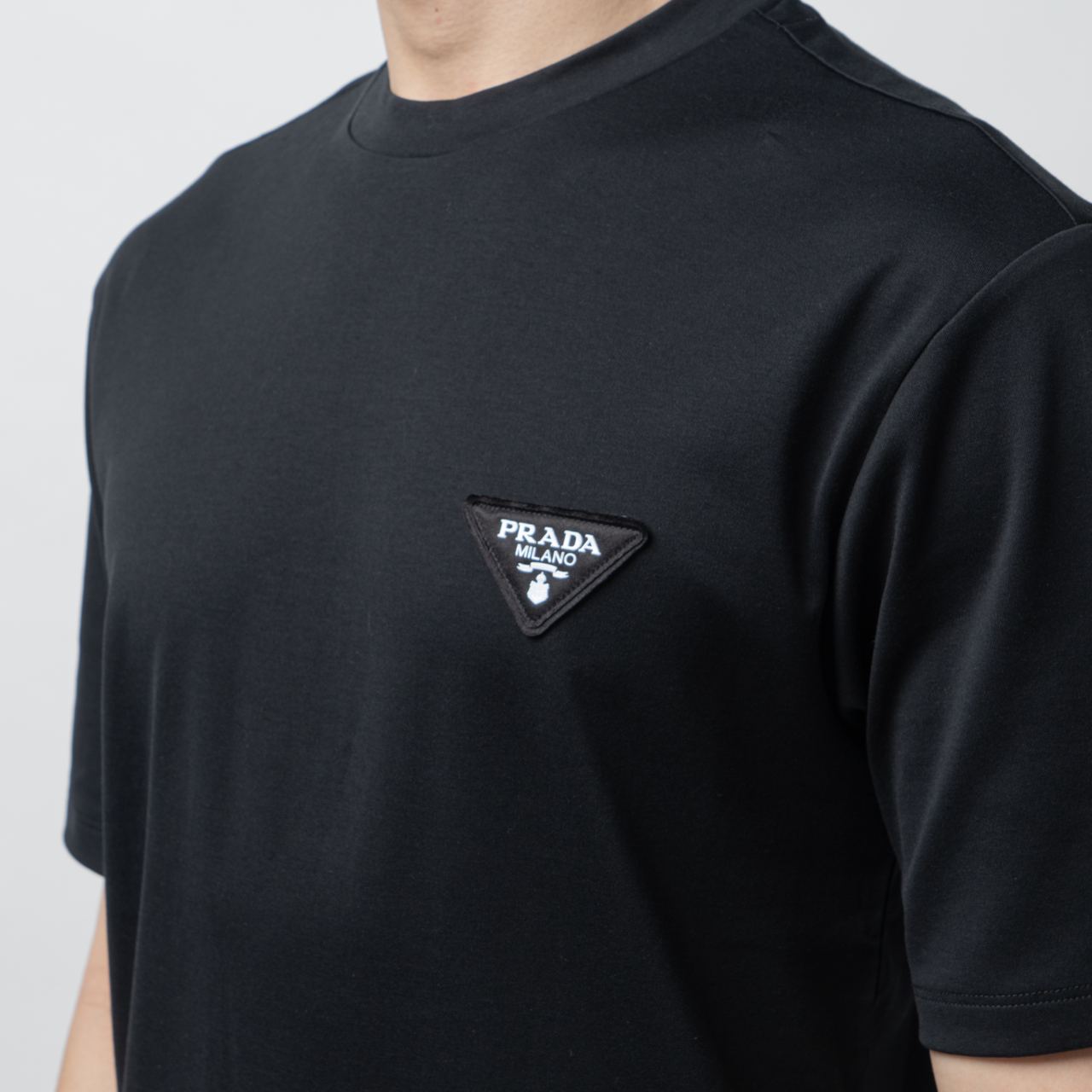 Prada Enamel White Logo Patch T-Shirt Black Men – voilà.id